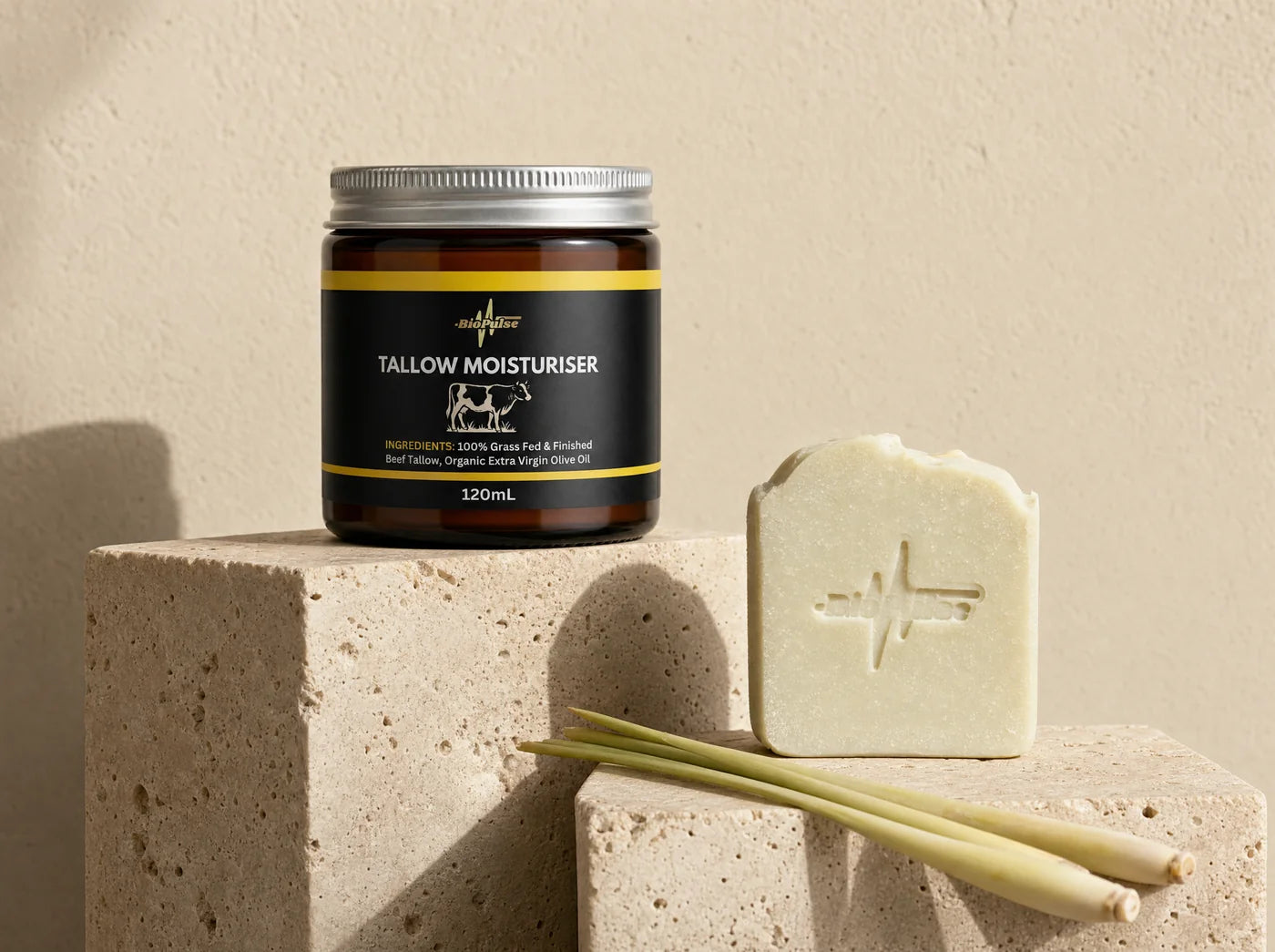 BioPulse tallow moisturiser jar and tallow soap bar on travertine stone plinths
