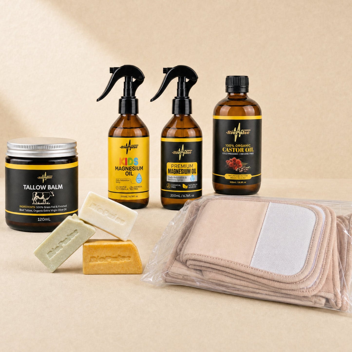 BioPulse Essentials Bundle with Tallow Balm jar, two magnesium oil sprays, castor oil, soap bars and beige wrap