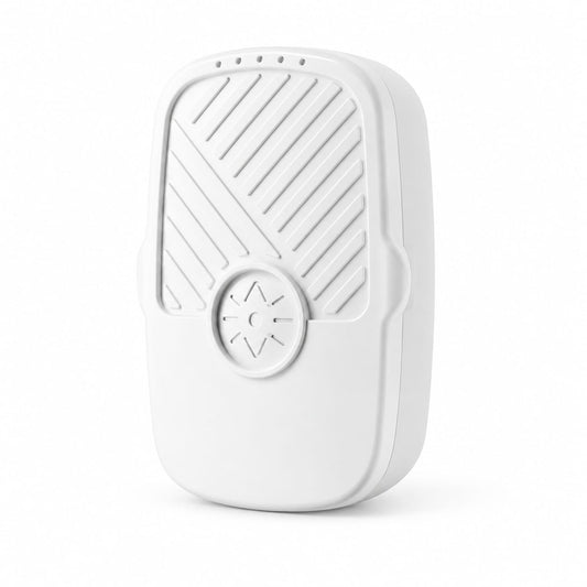 White FreshDip fruit and vegetable cleaner with its slotted face and attached cable.