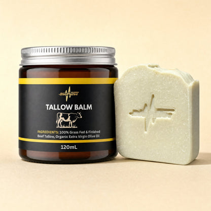 BioPulse Tallow Balm in a 120mL amber glass jar beside a pale green tallow soap bar