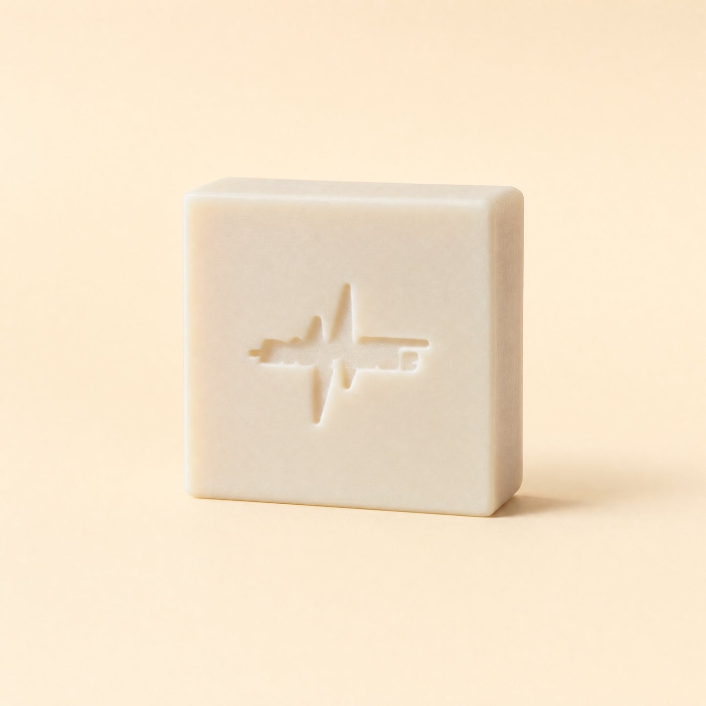 BioPulse Organic Tallow Soap plain cream bar with the pulse logo stamp on a cream background